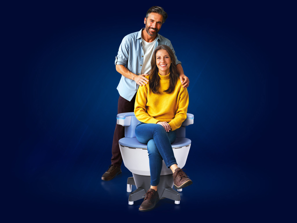 Patient sitting on Emsella chair for pelvic floor treatment